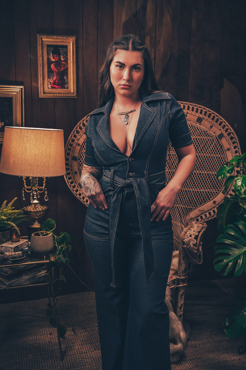 foxy Lola Love stretch denim bell bottom  jumpsuit with belted waist, front pockets, and a bold 70's inspired silhouette for effortless retro cool by soul sister since 1969