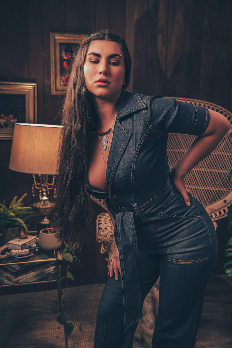 Lola Love stretch denim bell bottom  jumpsuit with belted waist, front pockets, and a bold 70's inspired silhouette for effortless retro cool by soul sister since 1969