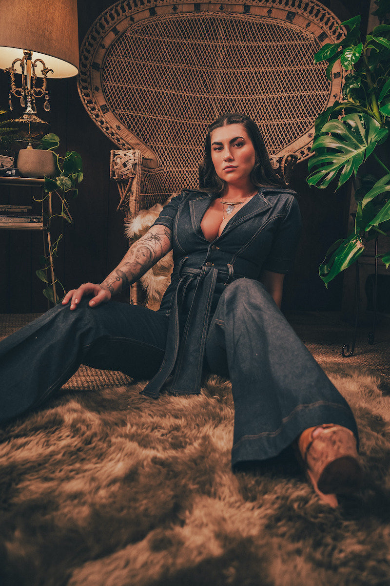Lola Love stretch denim bell bottom  jumpsuit with belted waist, front pockets, and a bold 70's inspired silhouette for effortless retro cool by soul sister since 1969