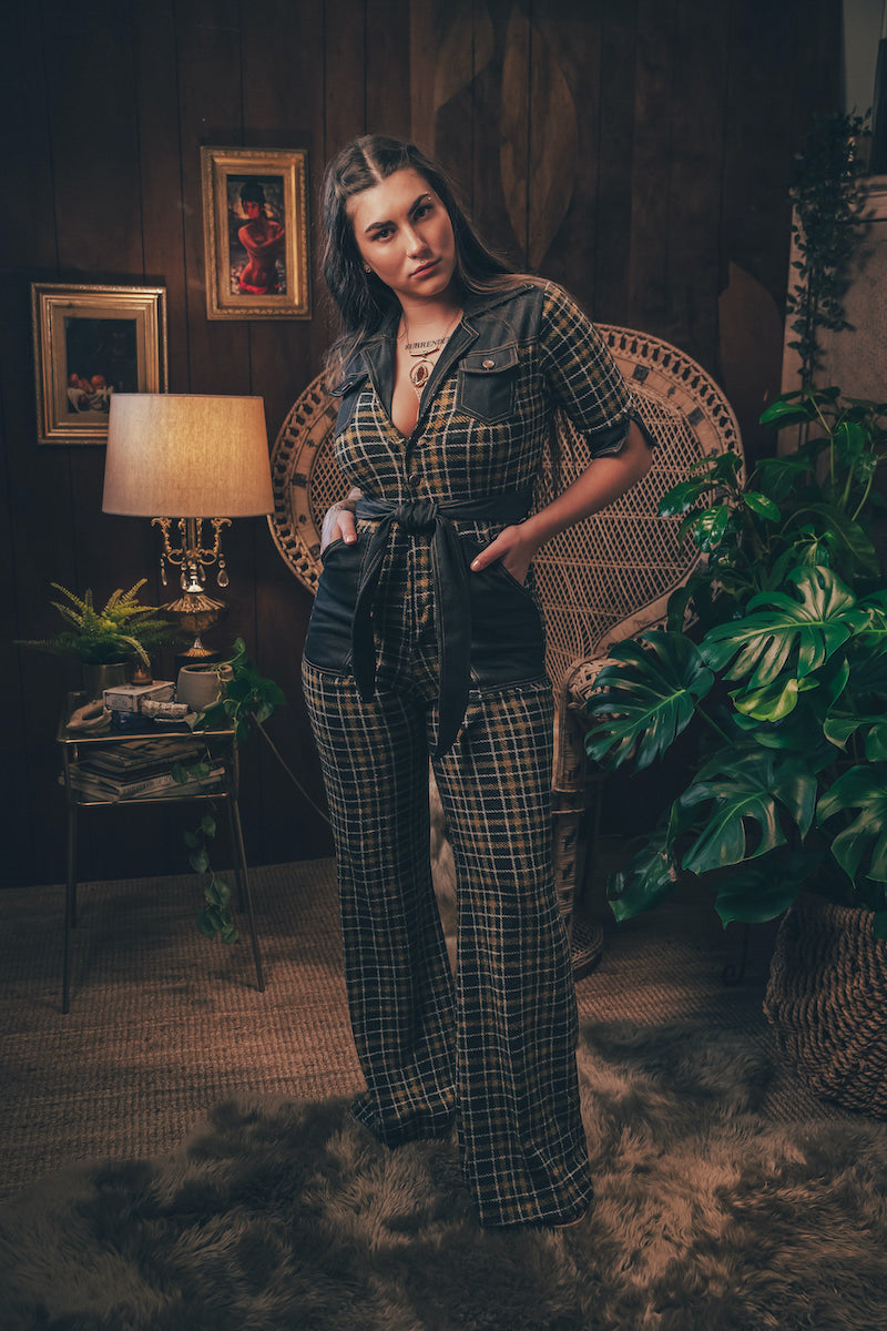 Knit plaid diva jumpsuit with contrasting denim front pockets, collar, and belt, blending retro 70's charm with bold, modern flair.