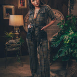 Knit plaid diva jumpsuit with contrasting denim front pockets, collar, and belt, blending retro 70's charm with bold, modern flair.