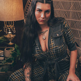 Knit plaid diva jumpsuit with contrasting denim front pockets, collar, and belt, blending retro 70's charm with bold, modern flair.