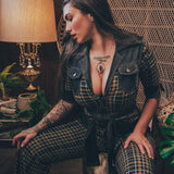 Knit plaid diva jumpsuit with contrasting denim front pockets, collar, and belt, blending retro 70's charm with bold, modern flair.
