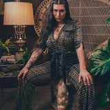Knit plaid diva jumpsuit with contrasting denim front pockets, collar, and belt, blending retro 70's charm with bold, modern flair.