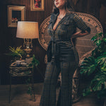 Knit plaid diva jumpsuit with contrasting denim front pockets, collar, and belt, blending retro 70's charm with bold, modern flair.