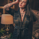 Knit plaid diva jumpsuit with contrasting denim front pockets, collar, and belt, blending retro 70's charm with bold, modern flair.