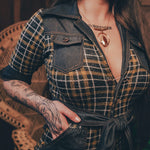 Knit plaid diva jumpsuit with contrasting denim front pockets, collar, and belt, blending retro 70's charm with bold, modern flair.