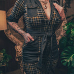 Knit plaid diva jumpsuit with contrasting denim front pockets, collar, and belt, blending retro 70's charm with bold, modern flair.