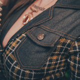 Knit plaid diva jumpsuit with contrasting denim front pockets, collar, and belt, blending retro 70's charm with bold, modern flair.