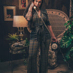Knit plaid diva jumpsuit with contrasting denim front pockets, collar, and belt, blending retro 70's charm with bold, modern flair.