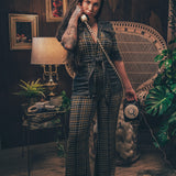 Knit plaid diva jumpsuit with contrasting denim front pockets, collar, and belt, blending retro 70's charm with bold, modern flair.