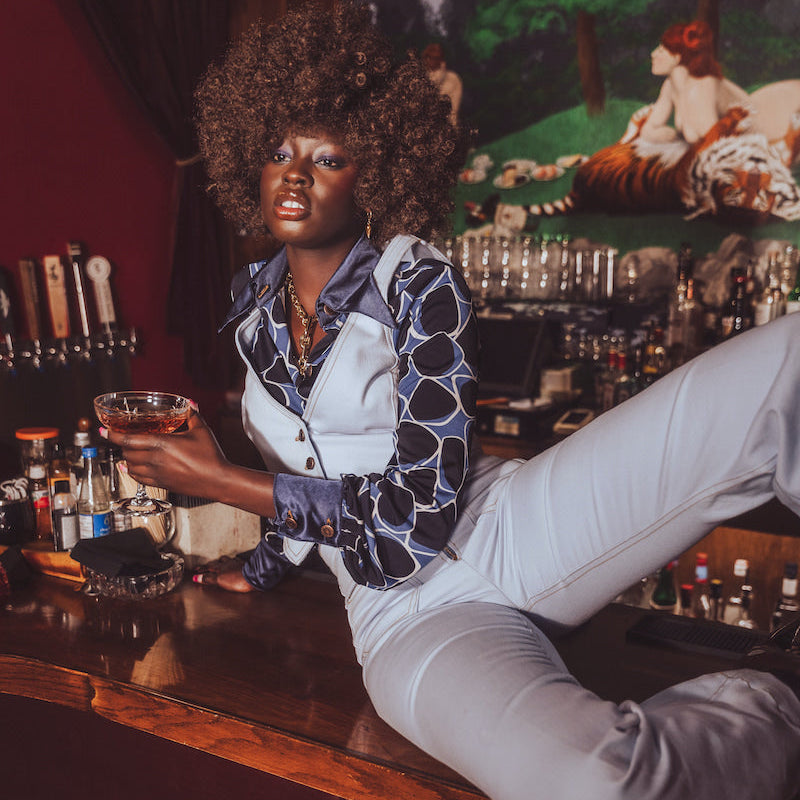 High-rise bell bottom jeans styled with a waistcoat, 70s inspired outfit by Soul Sister since 1969