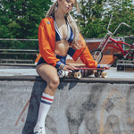 Soul Sister since 1969 orange retro bomber jacket on beauty blonde babe with her skateboard