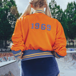 Soul Sister since 1969 orange retro bomber jacket on beauty blonde babe