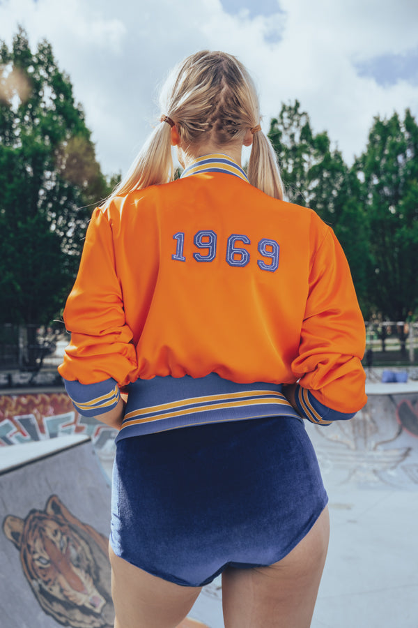 Soul Sister since 1969 orange retro bomber jacket on beauty blonde babe