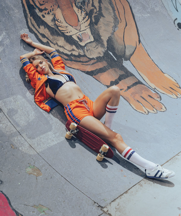 Soul Sister since 1969 orange retro bomber jacket on beauty blonde babe in skateboard bowl 