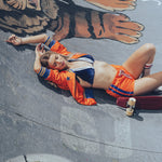 Soul Sister since 1969 orange retro bomber jacket on beauty blonde babe in skateboard bowl with her skateboard