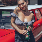 Soul Sisters Bridget Bardot crop top  and flower power skirt on model in front of red hot rod holding retro soda pop 