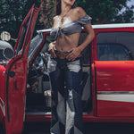 Soul Sisters Bridget Bardot crop top  and flower power skirt on model in front of retro hot rod 
