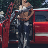 Soul Sisters Bridget Bardot crop top  and flower power skirt on model in front of retro hot rod 