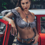 Bridget Bardot crop top on model in front of hot rod