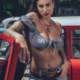 Bridget Bardot crop top on model in front of hot rod
