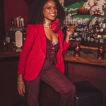 girl in a bar wearing all red suit
