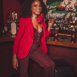 girl in a bar wearing all red suit
