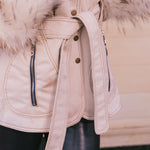 Close-up of a beige Penny lane vintage 70s inspired winter coat with fur  and belt