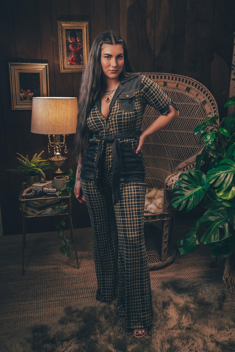 Knit plaid diva jumpsuit with contrasting denim front pockets, collar, and belt, blending retro 70's charm with bold, modern flair.