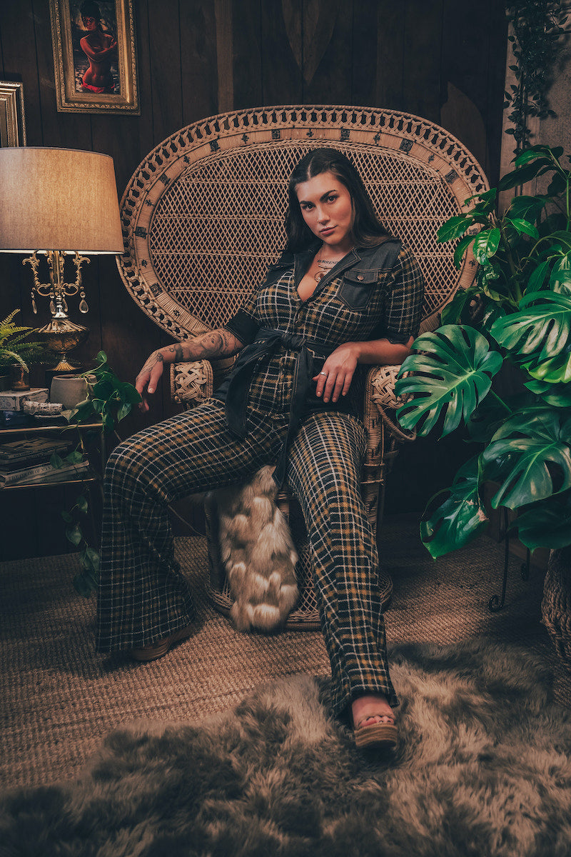 Knit plaid diva jumpsuit with contrasting denim front pockets, collar, and belt, blending retro 70's charm with bold, modern flair.