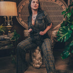 Knit plaid diva jumpsuit with contrasting denim front pockets, collar, and belt, blending retro 70's charm with bold, modern flair.