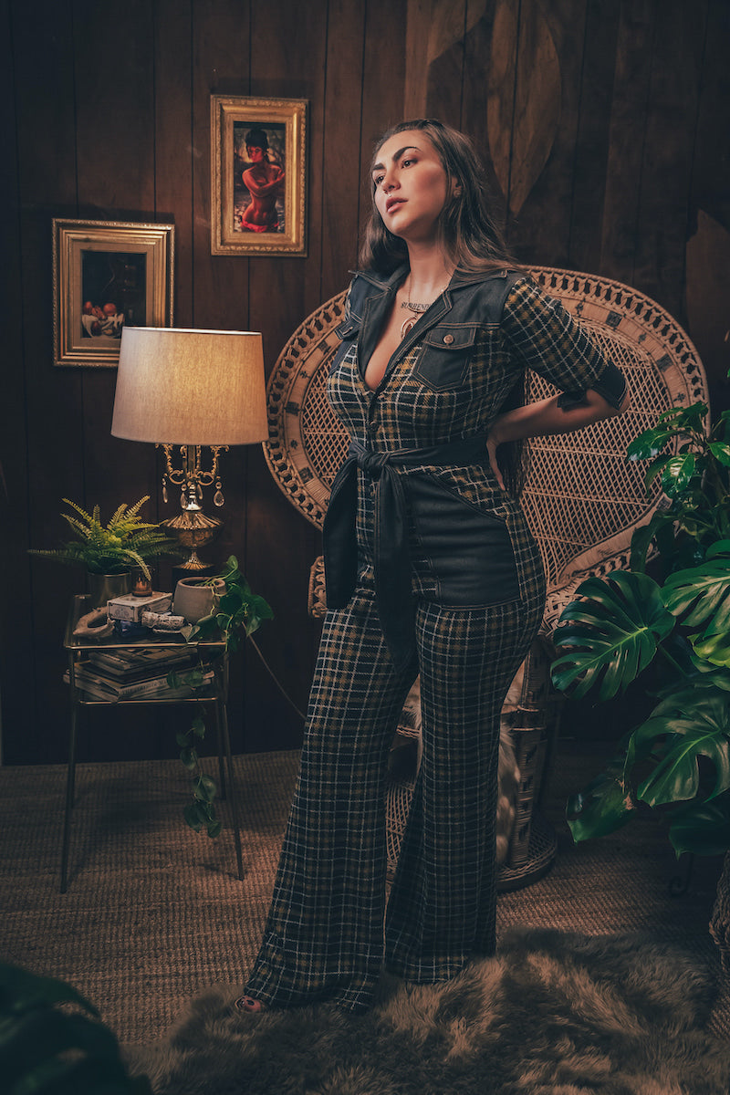 Knit plaid diva jumpsuit with contrasting denim front pockets, collar, and belt, blending retro 70's charm with bold, modern flair.