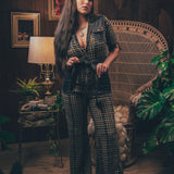 Knit plaid diva jumpsuit with contrasting denim front pockets, collar, and belt, blending retro 70's charm with bold, modern flair.