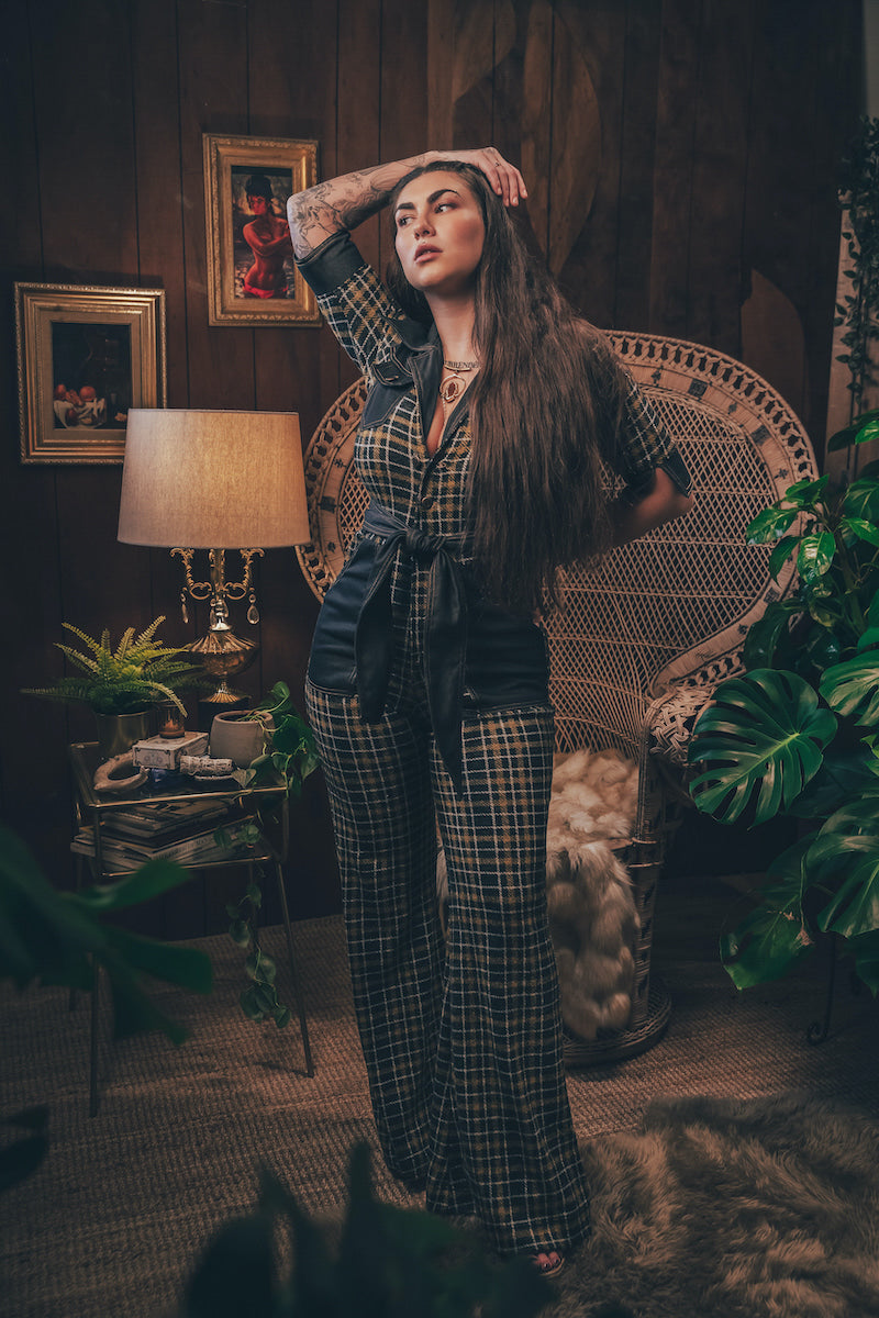 Knit plaid diva jumpsuit with contrasting denim front pockets, collar, and belt, blending retro 70's charm with bold, modern flair.