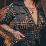 Knit plaid diva jumpsuit with contrasting denim front pockets, collar, and belt, blending retro 70's charm with bold, modern flair.