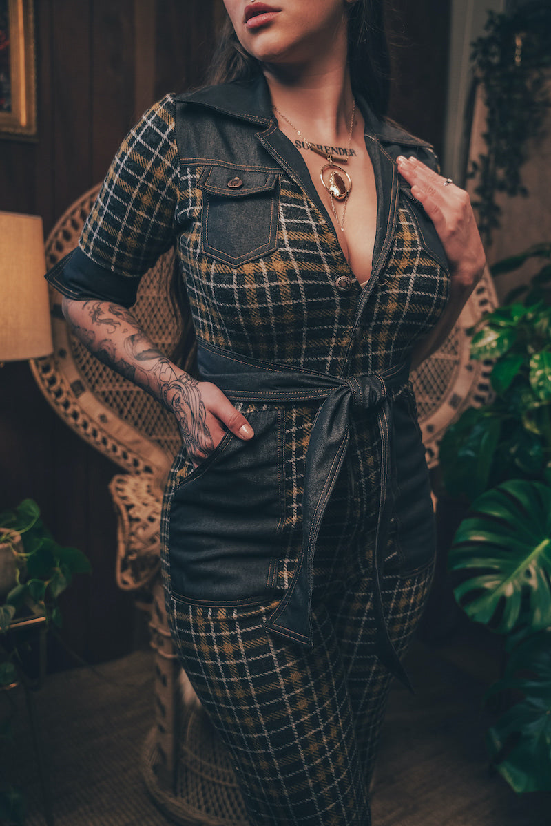 Knit plaid diva jumpsuit with contrasting denim front pockets, collar, and belt, blending retro 70's charm with bold, modern flair.