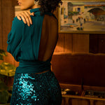 Soul Sister since 1969- Mary Gold Peek backless peek boo blouse teal with wrap detail, turtle neck, and long tulip sleeves, a sophisticated and sexy 70's inspired statement piece