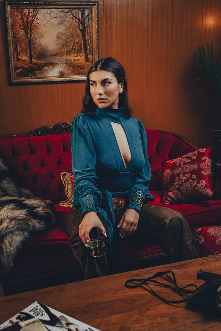 Soul Sister since 1969- Mary Gold Peek backless peek boo blouse teal with wrap detail, turtle neck, and long tulip sleeves, a sophisticated and sexy 70's inspired statement piece