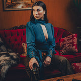 Soul Sister since 1969- Mary Gold Peek backless peek boo blouse teal with wrap detail, turtle neck, and long tulip sleeves, a sophisticated and sexy 70's inspired statement piece