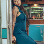 long flowy teal boho maxi dress with open back and ruffle details
