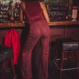 Person wearing a red jumpsuit in a bar setting