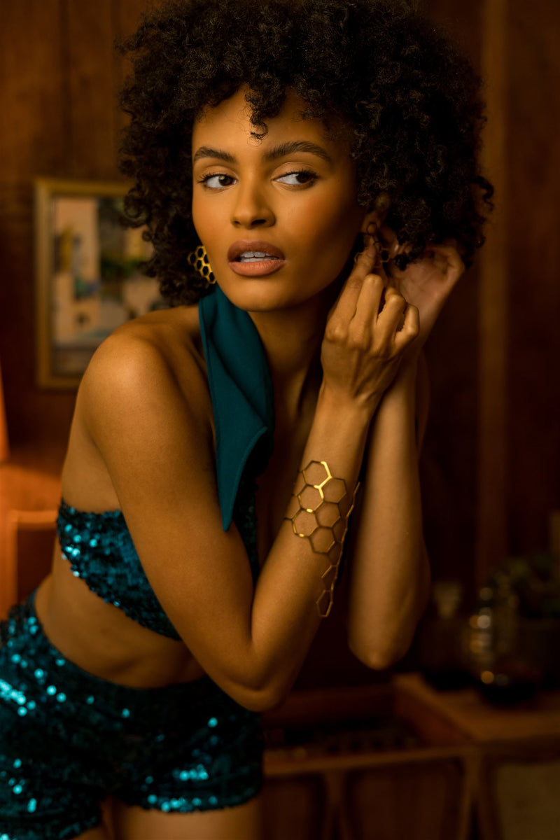 Beauty babe in soul sisters beverly sequin shorts putting on earrings