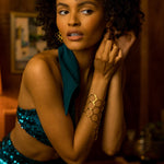 Beauty babe in soul sisters beverly sequin shorts putting on earrings
